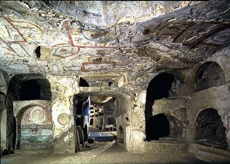 Interior of a catacomb chamber cut from tufa stone showing fragments of frescoed decoration van Anoniem