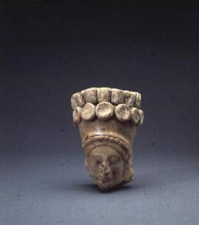 Terracotta head of the goddess Demeter, wearing a polos head dress decorated with pomegranates