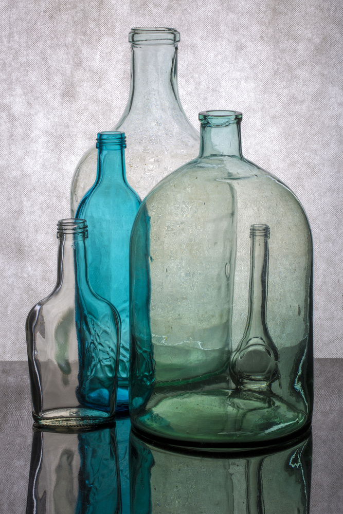 Still life with different transparent glass bottles van Brig Barkow