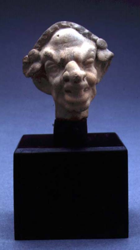Grotesque head of a woman van Greek
