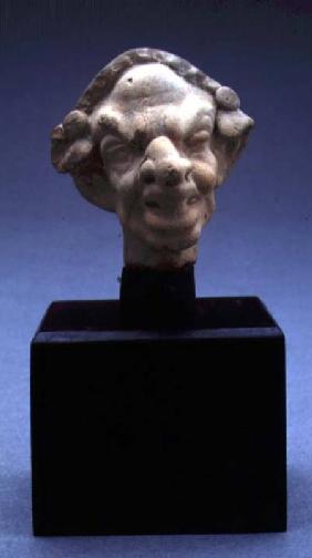 Grotesque head of a woman