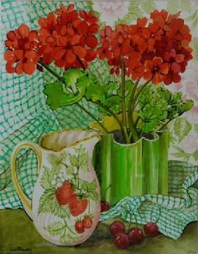 Red geranium with the strawberry jug and cherries