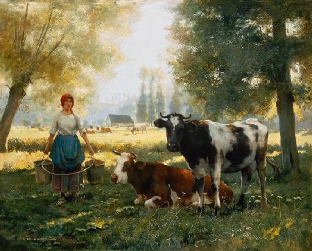 Melkmeisje met haar koeien