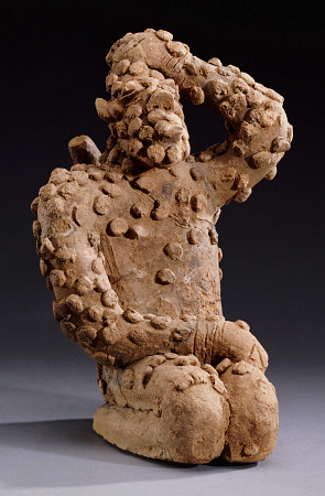 A Djenne Terracotta Kneeling Male Figure, 14th Century van 