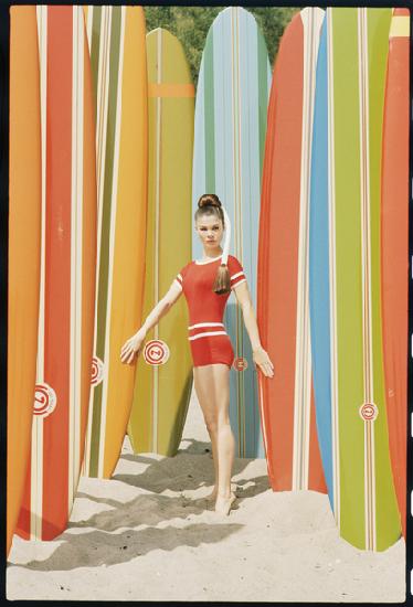 Actress Wende Wagner with surfboards on the beach in Malibu