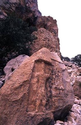 Rock carving thought to be King Worod holding what maybe a cloth or a towel