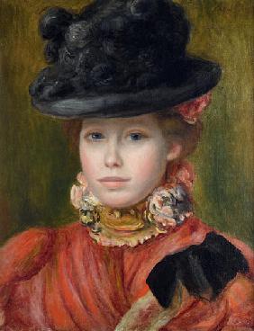 Girl in black hat with red flowers