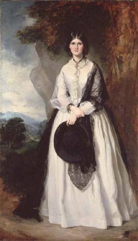 Young woman in white dress against a landscape